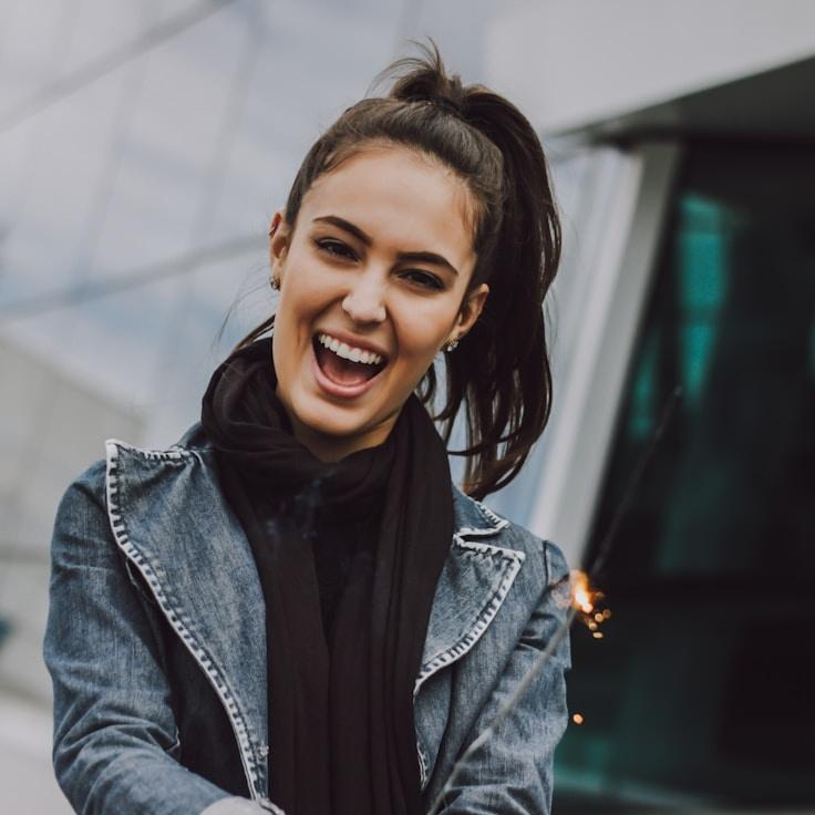 Kaveri Mehta, Lead Design Curator at Universal System Hub, reviewing corporate floral arrangements